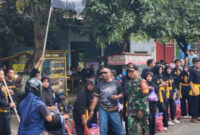Babinsa dan Bhabinkamtibmas Amankan Bagi Takjil PSHW-TM Belotan
